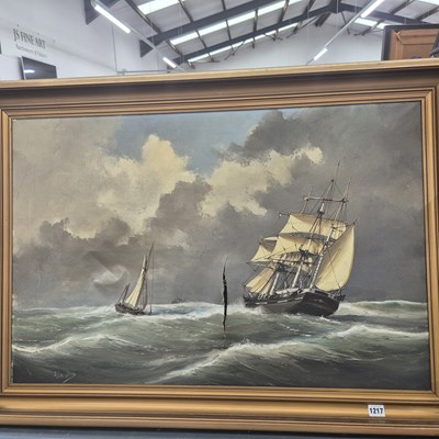 Lot 1217 - A large oil on canvas ships in a stormy sea.