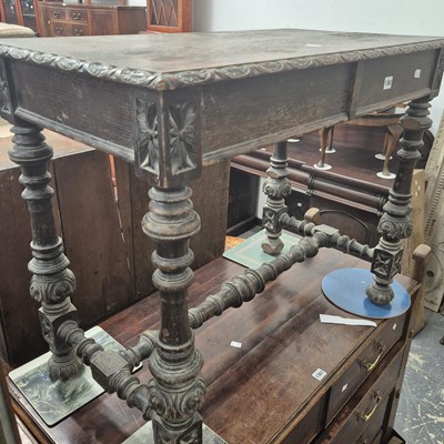 Lot 1360 - An oak side table with blind frieze drawers....