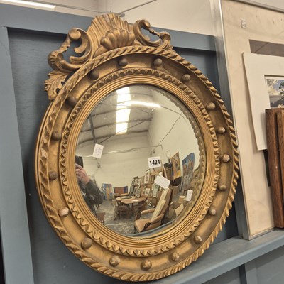 Lot 1424 - A 19th century convex wall mirror.
