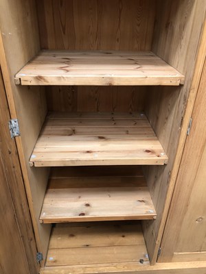 Lot 1451 - A large pine wardrobe. W 178 D 59 H 185 cm