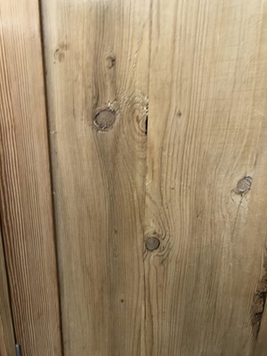 Lot 1451 - A large pine wardrobe. W 178 D 59 H 185 cm