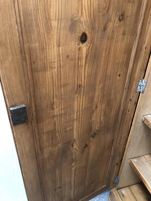 Lot 1451 - A large pine wardrobe. W 178 D 59 H 185 cm