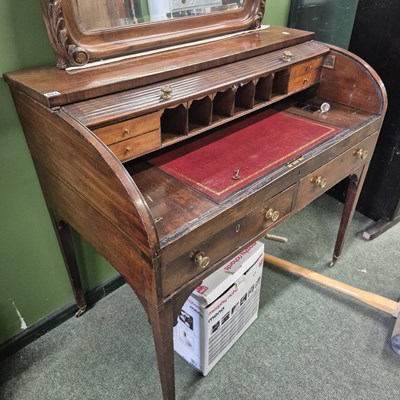 Lot 807 - A Regency mahogany writing desk with tambour...