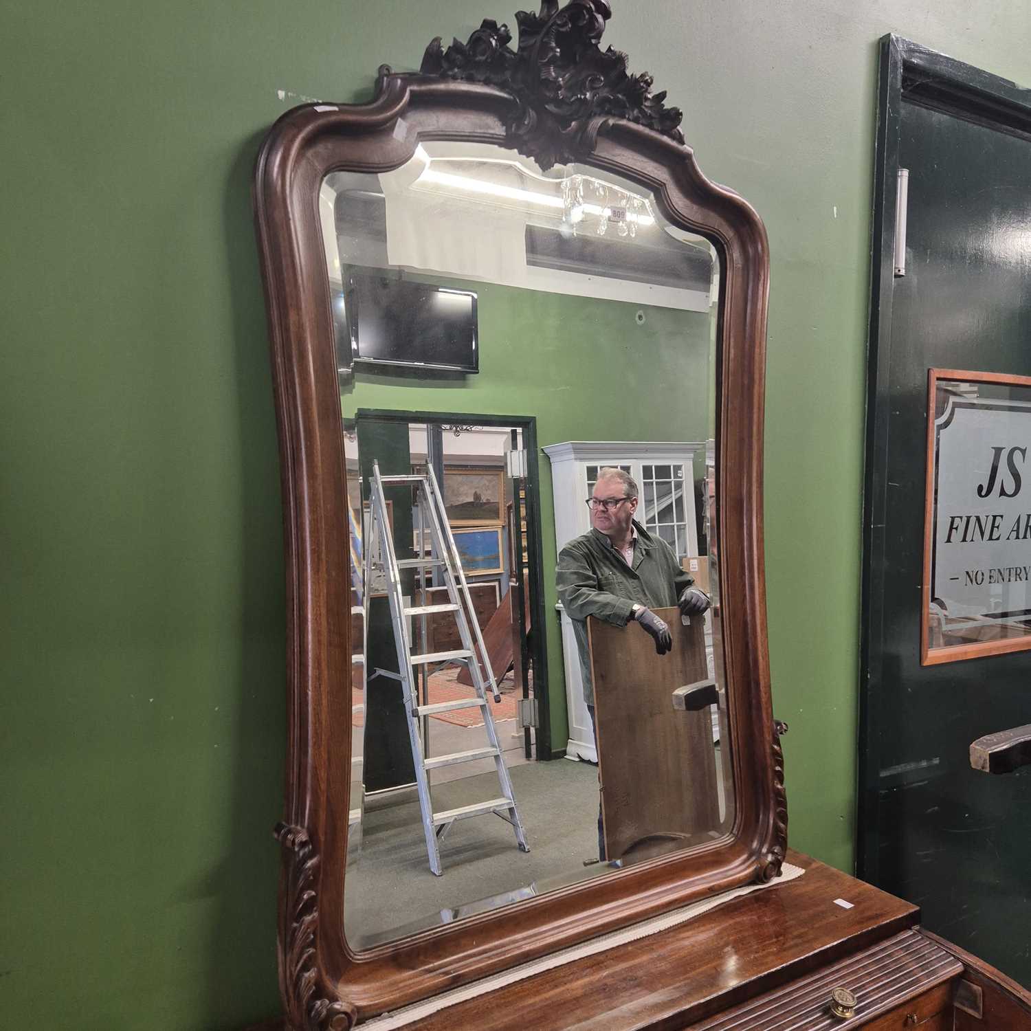Lot 809 - A large mahogany framed wall mirror.