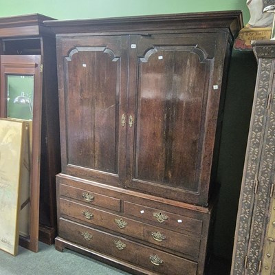 Lot 819 - An 18th century oak press cupboard fitted for...