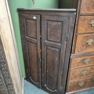 Lot 825 - A Georgian oak corner cabinet