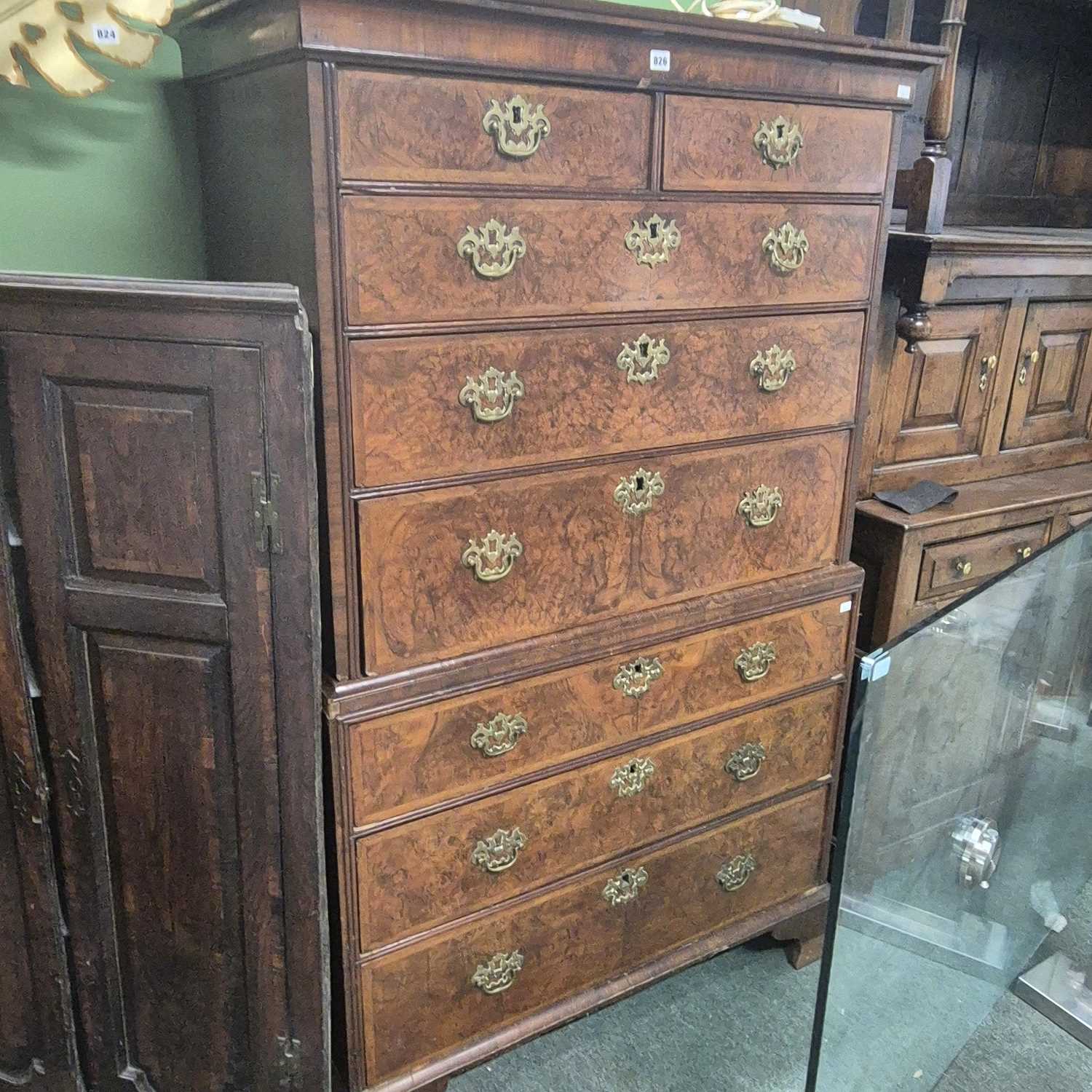 Lot 826 - An 18th century Walnut chest on chest.