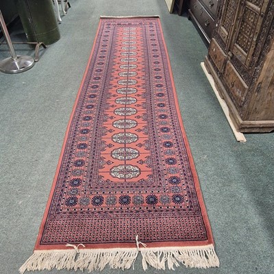 Lot 831 - A carpet runner of baluch design