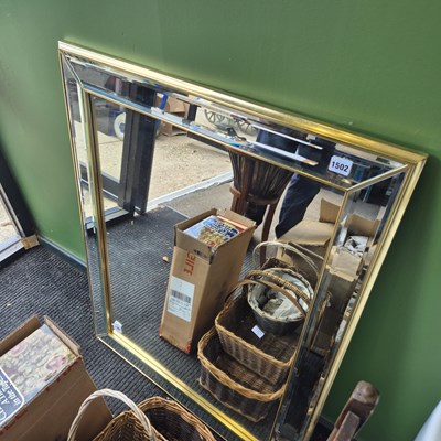 Lot 1502 - A modern wall mirror with marginal frame.