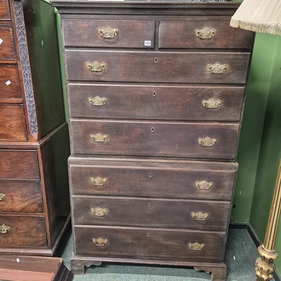 Lot 1503 - A Geo III oak chest on chest of eight drawers.