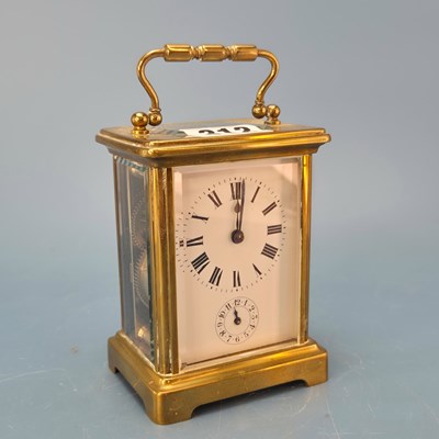 Lot 312 - An alarm carriage clock ringing on a bell at...