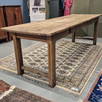 Lot 357 - A pine refectory table on pairs of fluted...