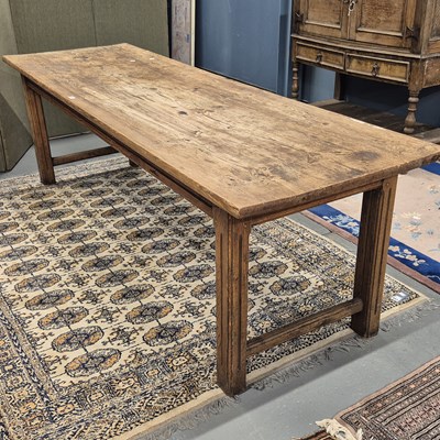 Lot 357 - A pine refectory table on pairs of fluted...