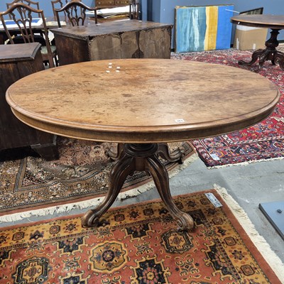 Lot 363 - A mahogany oval breakfast table, the baluster...