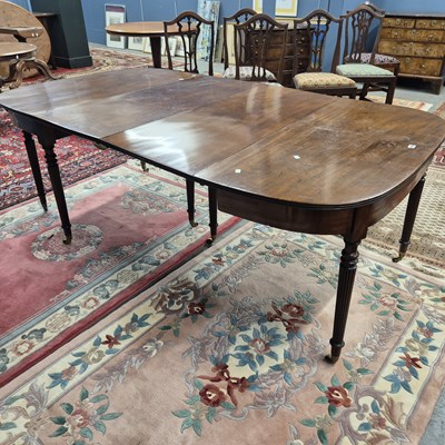 Lot 364 - A mahogany D-end dining table with two leaves,...
