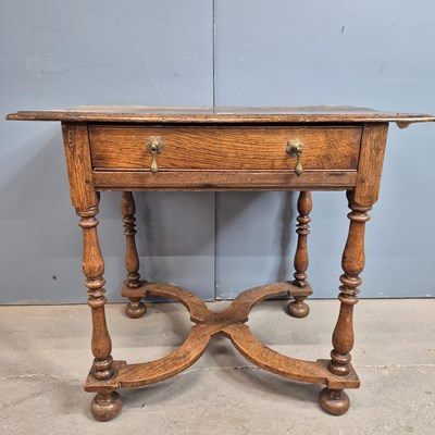 Lot 369 - An 18th century oak table with a single drawer...