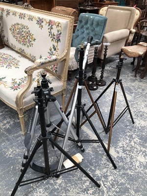 Lot 1074A - A group of photographic or lighting tripods