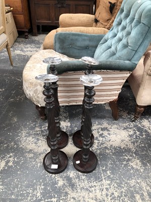 Lot 1074B - Four wood and metal candlesticks