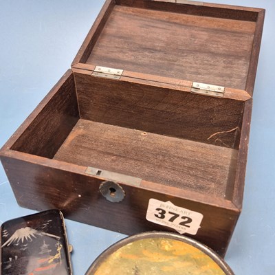 Lot 372 - A papier mache table snuff box bearing a scene...