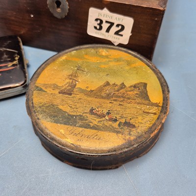 Lot 372 - A papier mache table snuff box bearing a scene...