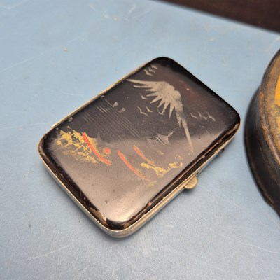 Lot 372 - A papier mache table snuff box bearing a scene...