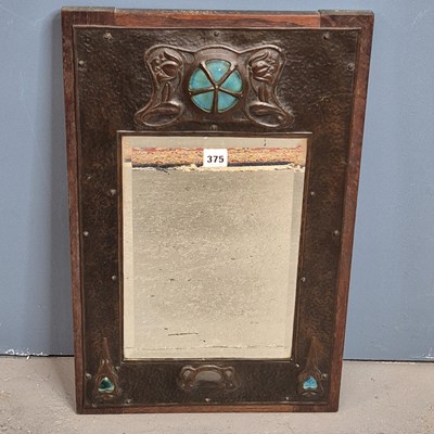 Lot 375 - An Arts and Crafts rectangular bevelled glass...