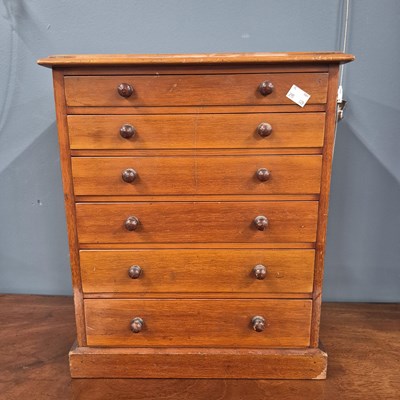 Lot 381 - A mahogany table top, a collector's chest of...