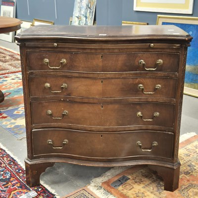 Lot 384 - A George III mahogany serpentine chest with a...