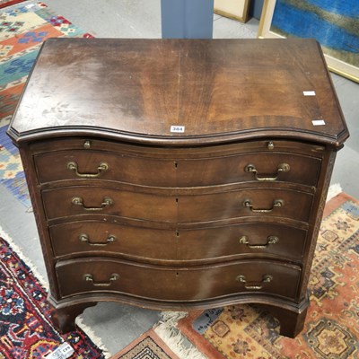 Lot 384 - A George III style mahogany serpentine chest...