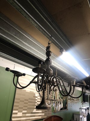 Lot 705 - An eight armed brass chandelier.