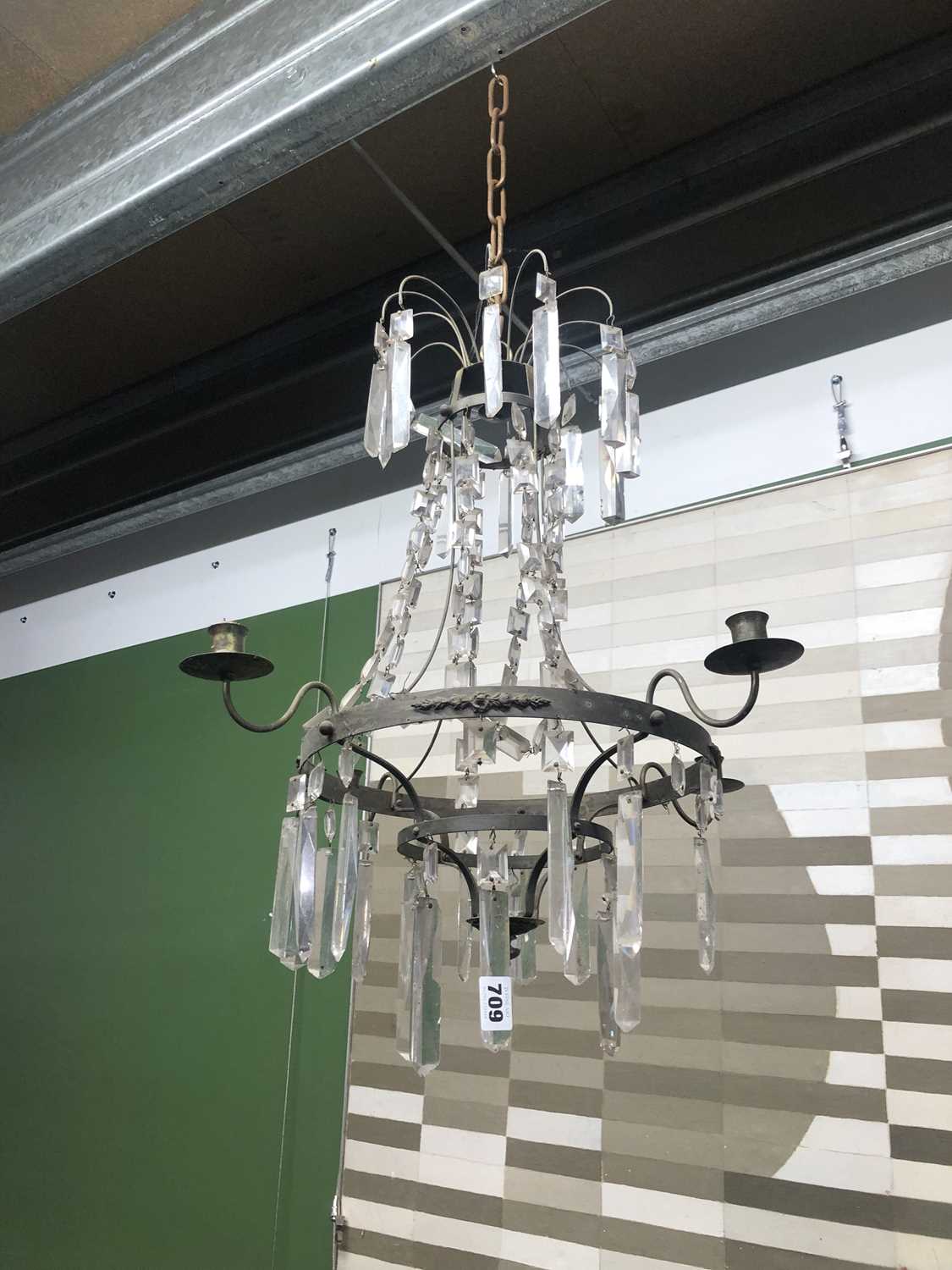 Lot 709 - Two, four armed crystal and metal chandeliers.