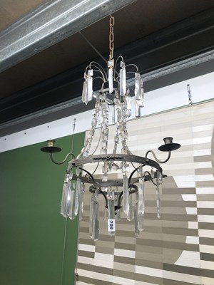 Lot 709 - Two, four armed crystal and metal chandeliers.