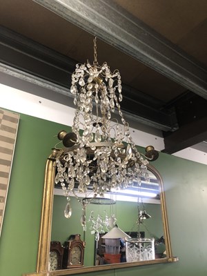 Lot 709 - Two, four armed crystal and metal chandeliers.