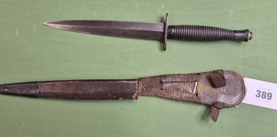 Lot 389 - A blackened double edged Commando dagger...
