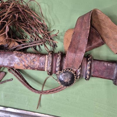 Lot 391 - An African single edged curved sword with a...