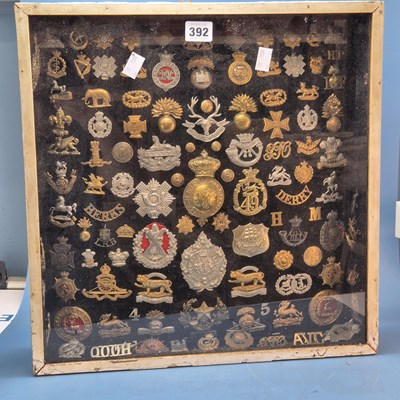 Lot 392 - Two glazed wall display cases of military cap...