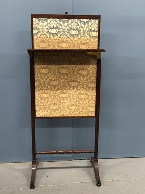 Lot 395 - A late 19th century mahogany firescreen, the...