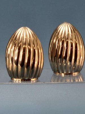 Lot 136 - L'Objet. A pair of ripple platinum-plated...