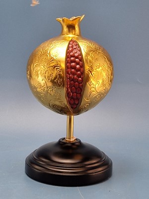 Lot 141 - Lladro. A ceramic pomegranate figurine, golden...