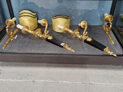Lot 145 - Versace. A pair of twin branch wall lights and...