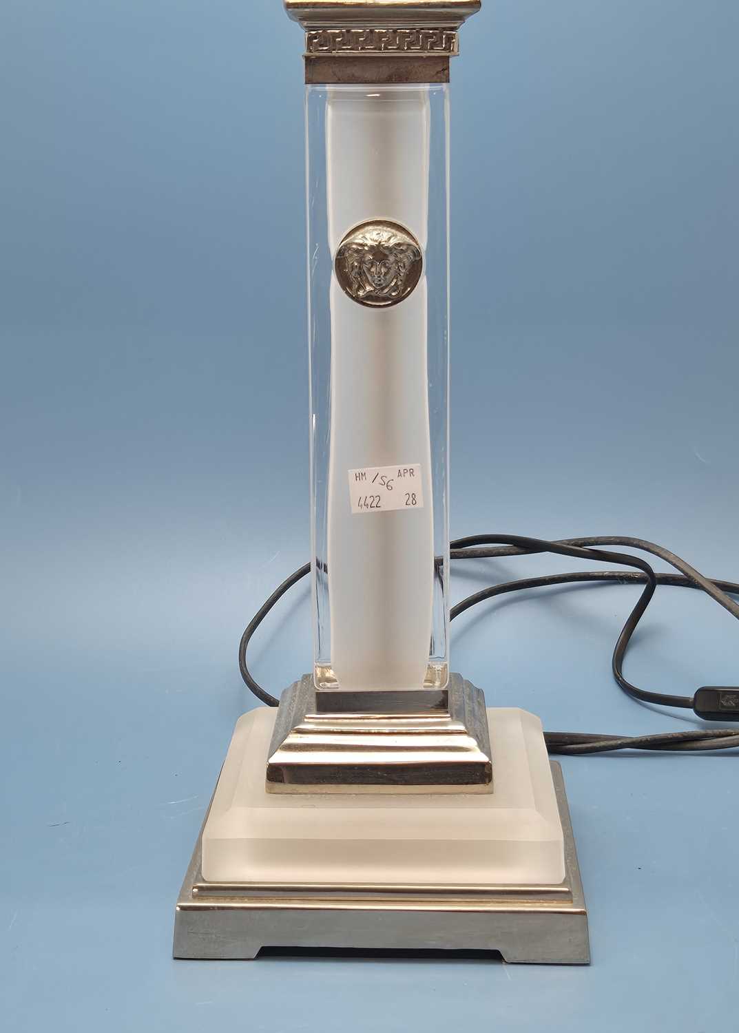 Lot 156 - Versace. A frosted glass column and silver...