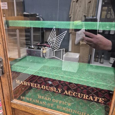 Lot 613 - A vintage Oak display cabinet with glazed door...