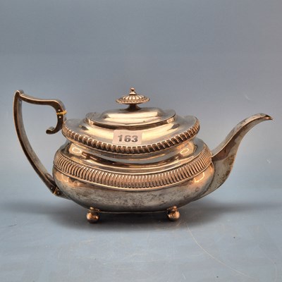 Lot 163 - A George III silver tea pot marks worn, London...