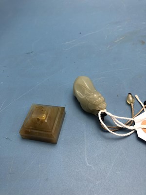 Lot 170 - A Chinese nephrite jade Buddhist lion pendant...