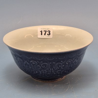 Lot 173 - A Chinese porcelain bowl, the exterior moulded...