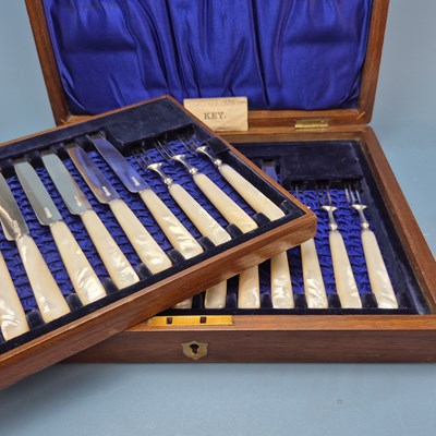 Lot 193 - A mahogany cased set of twelve mother of pearl...