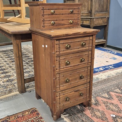 Lot 107 - A pine chest with two drawers recessed above...