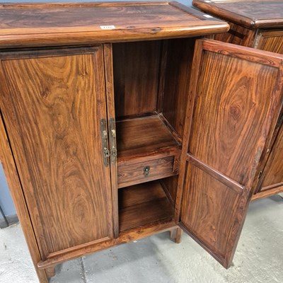 Lot 108 - A pair of Chinese hardwood cabinets, the sides...