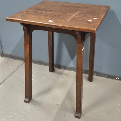Lot 110 - An Arts and Crafts oak table supported on four...