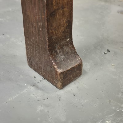 Lot 110 - An Arts and Crafts oak table supported on four...